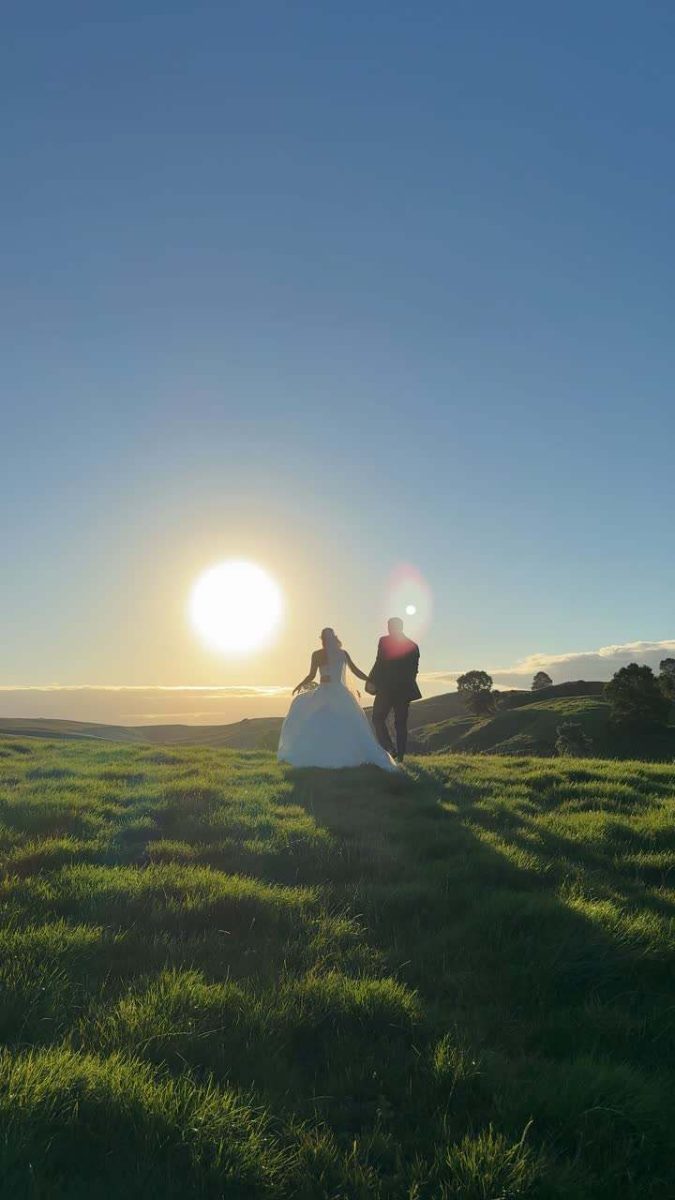 A couple at golden hour in an open field
